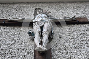 A picture of Jesus` crucifixion on the wall of the church in Halstat, Austria..