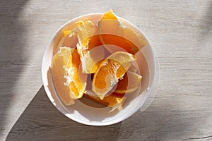 Picture of juicy fresh orange wedges in a bowl