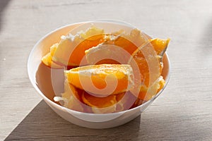 Picture of juicy fresh orange wedges in a bowl