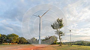 Picture of a large white wind turbine for generating electricity,