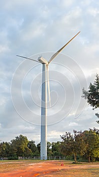 Picture of a large white wind turbine for generating electricity,