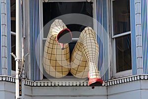 Legs with nylons sticking out of a window in San Francisco California