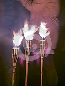 Picture with light paintings, three burning torches