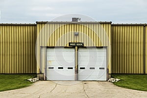 Loading dock doors at a yellow warehouse building