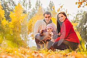 Picture of lovely family in autumn park, young parents with nice adorable kids playing outdoors, five cheerful person have fun on