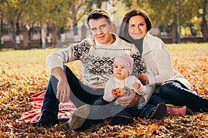 Picture of lovely family in autumn park, young parents with nice adorable kids playing outdoors, five cheerful person have fun on