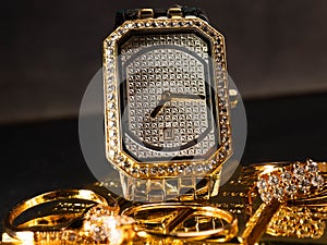 Picture of luxury woman wrist watch. Thus watch on a gold color and silver dial