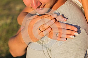 Picture of man and woman with wedding ring.Young married couple holding hands, ceremony wedding day. Newly wed couple`s