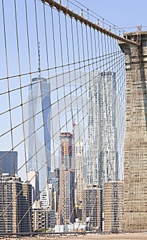 Picture of Manhattan skyscrapers seen from Brooklyn Bridge, NYC, USA.