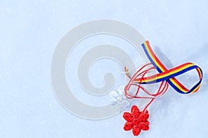 Picture with martisor and romanian tricolor elements on snow white background. Moldavian and Romanian spring symbol.