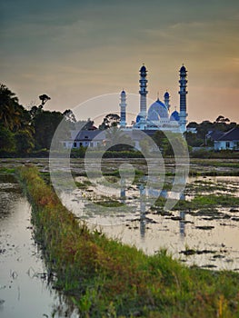 A picture of masjid Kubang Batang, or mosque Kubang Batang in tumpat kelantan during sunrise. Its a new attraction for tumpat city photo