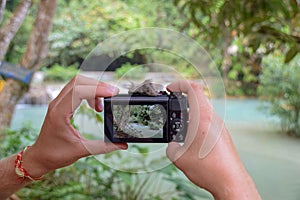 Taking a Picture with the Canon G7 at Kuang Si Waterfalls, Laos. photo