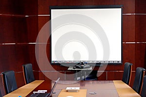 Picture of a meeting room with all the modern tools needed for an efficient communication. photo
