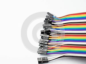 Picture of multi colors cables with black socket on a white isolated background