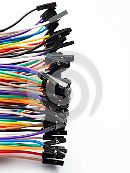 Picture of multi colors cables with black socket on a white isolated background