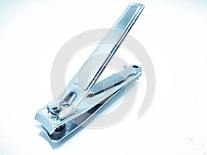 A picture of nail cutter on white surface ,