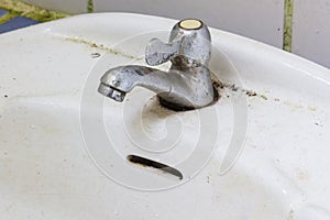 The picture of the old rusty water tap,