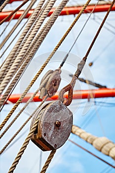 Picture of old sailing ship wooden pulley.