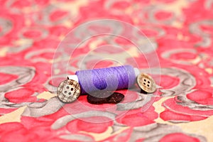 Picture of one sewing thread and button