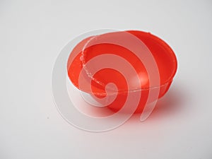 Picture of an orange plastic cap miniature