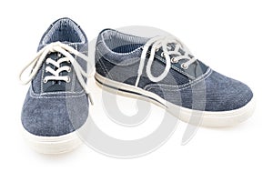 Picture of a pair of blue trainers over a white background.