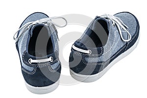 Picture of a pair of blue trainers over a white background.