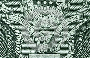 Picture of part of Great Seal of the United States with writing E Pluribus Unum, Out of many one, printed on One USA dollar photo