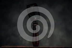 Picture of particle board handsaw in front of dark texture background