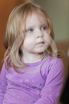 Picture of pensive small girl with blue eyes