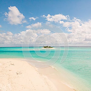 Picture perfect beach and turquoise lagoon on small tropical island on Maldives