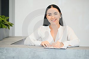 Picture of pretty receptionist at work.