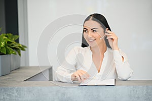 Picture of pretty receptionist at work.