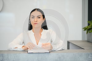 Picture of pretty receptionist at work.