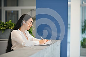 Picture of pretty receptionist at work.