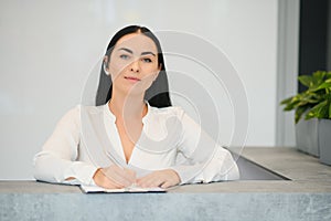 Picture of pretty receptionist at work.