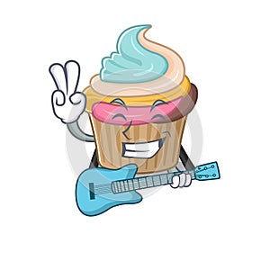 A picture of rainbow cupcake playing a guitar
