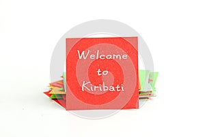 Picture of a red note paper with text welcome to kiribati