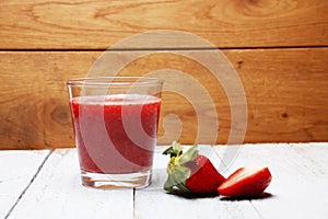 A picture of a red strawberry shake smoothies photo