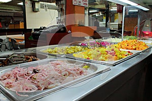 Picture of a salad bar at the booth with Shwarma