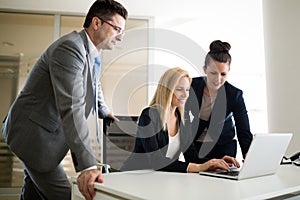 Picture of sales agents working together in office