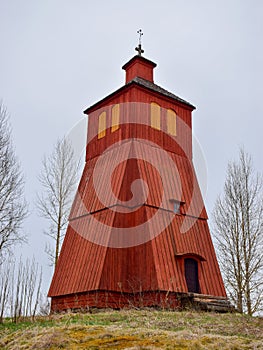 Picture with Scandinavian-style red very old wooden house, wooden tile roof photo