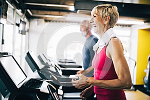 Picture of senior people running on treadmill in gym