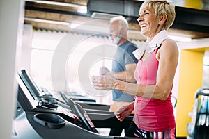 Picture of senior people running on treadmill in gym