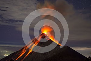 Volcano eruption with lava captured at night, on the Volcano Fuego in Guatemala photo