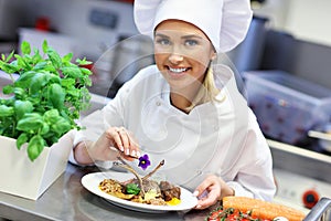 Busy chef at work in the restaurant kitchen