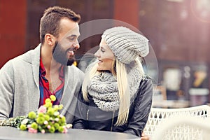 Picture showing young couple with flowers dating in the city