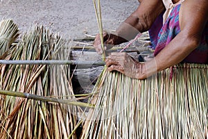 Picture shows how to make a panel vetiver for hut roof, handwork crafts of panel vetiver for hut roof, straw roof hut