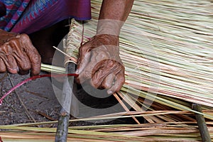 Picture shows how to make a panel vetiver for hut roof, handwork crafts of panel vetiver for hut roof, straw roof hut