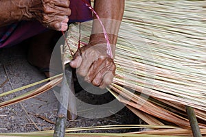 Picture shows how to make a panel vetiver for hut roof, handwork crafts of panel vetiver for hut roof, straw roof hut