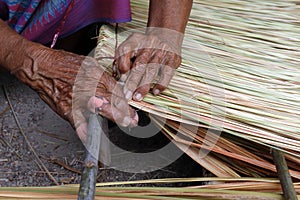 Picture shows how to make a panel vetiver for hut roof, handwork crafts of panel vetiver for hut roof, straw roof hut